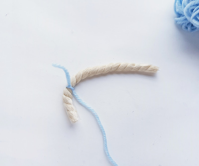 starting to wrap the first piece of rope in yarn